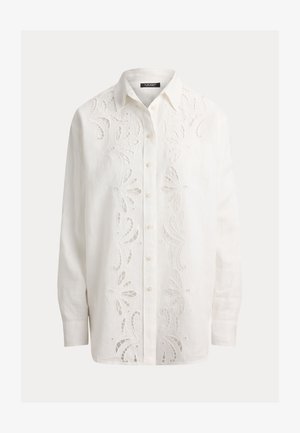 Fehér, hosszú ujjú, gombos ing, elülső részén virágmintás kivágásos hímzéssel és hegyes nyakkal.