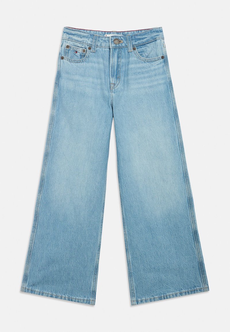 Lyseblå vide jeans laget av denim, med fem lommer, knappeåpning og kontraststing langs sømmene.