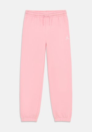 Růžové tepláky s elastickým pasem, šňůrkou na stažení a manžetami na kotnících, s malým bílým logem Jumpman na pravém stehně.