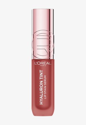 Hyaluron Tint Lippenstift-Serum in einem rechteckigen Tubus; rosa metallischer Deckel; tiefrosafarbener Farbton mit weißem Text auf dem Körper.