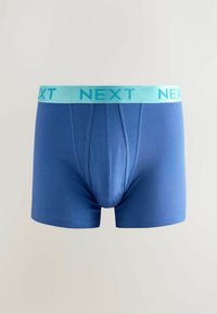 Kék pamut boxerAlsónemű világoskék gumival a derekán, amelyen a "NEXT" felirat ismétlődő mintázatban szerepel. Simító textúra, testhezálló kialakítás.