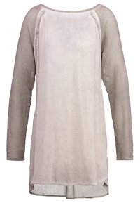 Tunique à manches longues avec manches en résille beige et panneau avant uni beige clair, présentant un col rond et un tissu légèrement transparent.