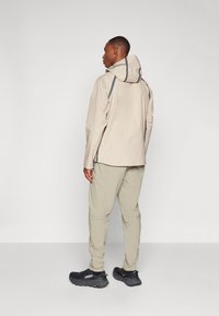 Jack Wolfskin HIKEOUT - Lauko kelnės - stone