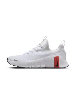 White athletic sneaker with flexible sole, black Nike swoosh on toe and heel, and red rectangular detail on outer side.