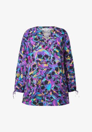 V-halsblouse met een overal doodskoppatroon in levendige paarse, blauwe en gele tinten. Lange mouwen met verstelbare strikdetails.