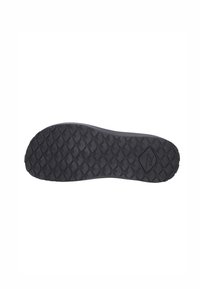 Semelle de chaussure en caoutchouc noir présentant un motif texturé en diamant pour une traction optimale, avec une forme arrondie et un détail de logo visible sur un côté.
