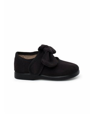 Black suede shoe with a rounded toe, elastic edges, and a fabric bow accent on the front. Smooth texture and flat rubber sole.