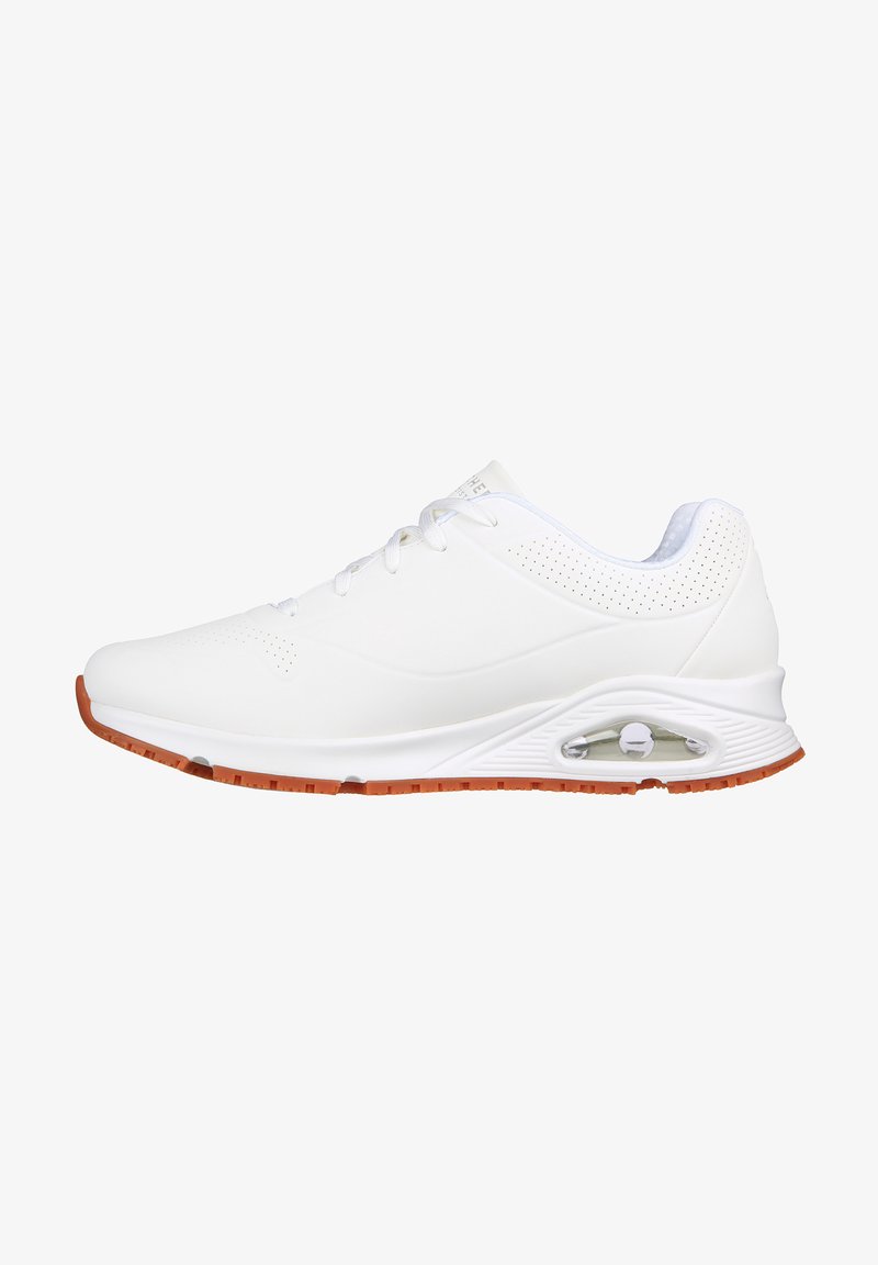 White athletic shoes with a smooth synthetic upper, perforated detailing, and tan rubber sole featuring a visible air cushioning unit.