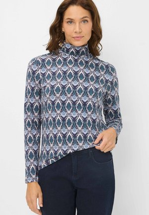 Rollkragenoberteil mit langen Ärmeln aus gemustertem Stoff, der blaue, grüne und weiße Tropfenmuster zeigt. Fitted Silhouette, glatte Textur und abgerundeter Saum.
