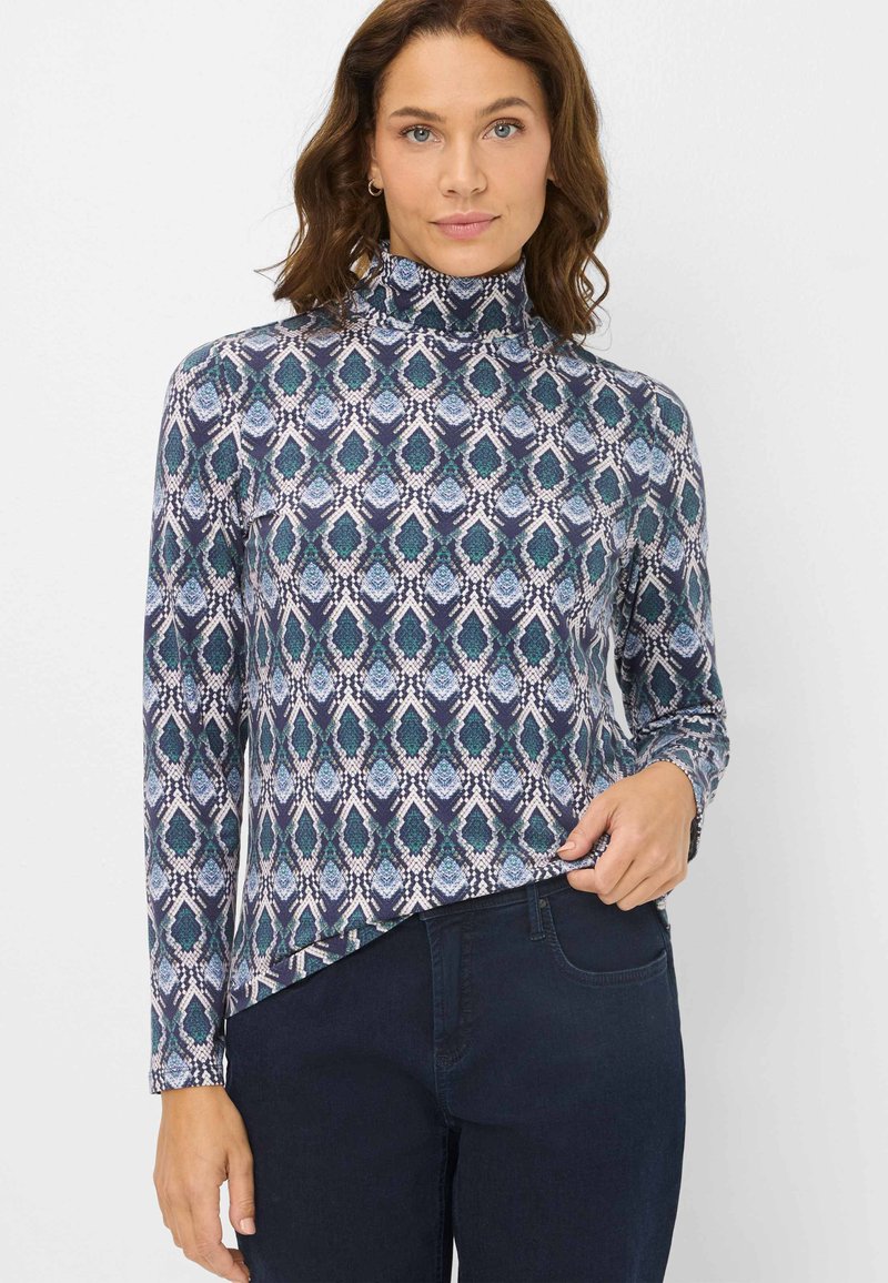 Maglione a collo alto con maniche lunghe in tessuto a fantasia caratterizzato da motivi a goccia in blu, verde e bianco, silhouette aderente, texture morbida e orlo curvo.