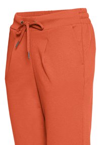 Rozsdaszínű melegítőnadrág elasztikus derékpánttal, állítható húzózsinórral és oldalzsebekkel, deréktől a combközépig ábrázolva.