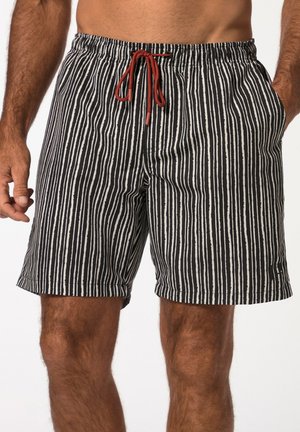 Schwarz-weiße gestreifte Badeshorts mit einem elastischen Bund, rotem Kordelzug und Seitentaschen. Weicher Stoff mit lässigem Design.