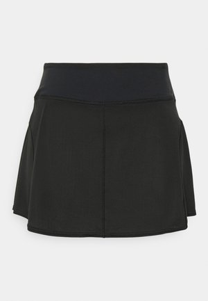 Jupe sportive noire avec une large taille élastique, un tissu texturé et une conception évasée avec des fentes sur les côtés pour faciliter les mouvements.