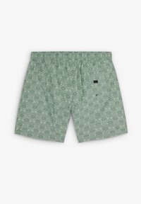 Shorts de bain à motifs verts avec un design floral, ceinture élastique et un petit logo brodé sur le côté arrière droit.
