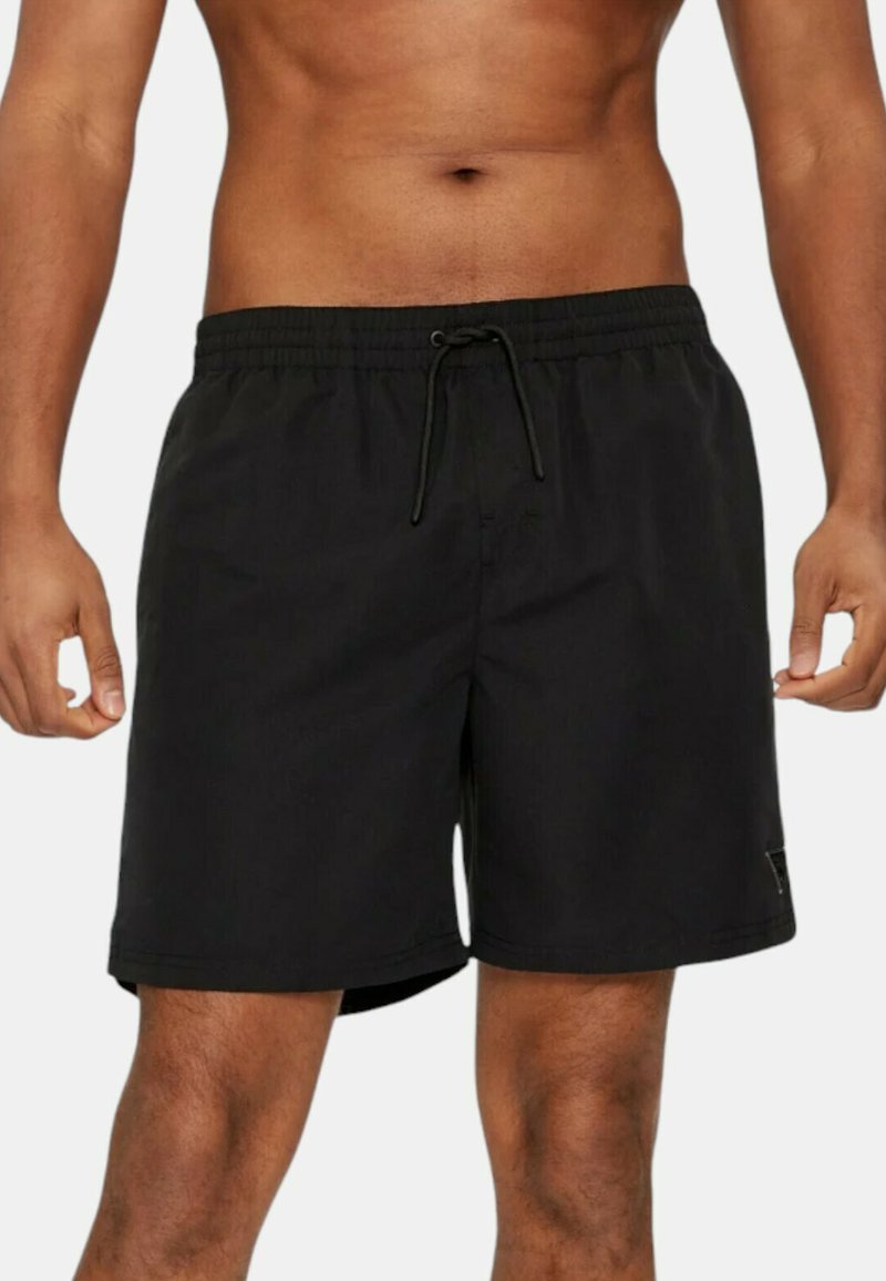 Costumi da bagno neri realizzati in tessuto leggero, con vita elastica dotata di cordoncino e una piccola etichetta con logo di lato.