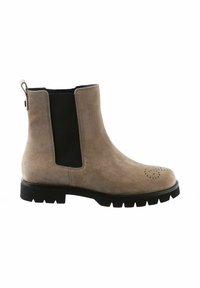 Stivale alla caviglia in suede beige con pannelli elastici neri sui lati, punta tonda e dettagli perforati. Suola in gomma nera spessa con scanalature.