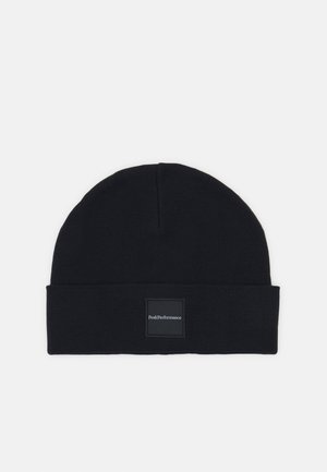 Black knit beanie hat with a cuffed design and a square logo patch labeled "PeakPerformance" on the front for branding.
