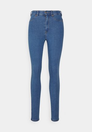Slim-fit blue denim jeans with a high waist, contrasting stitching, five pockets, and a zipper fly, featuring a smooth finish and ankle-length cut.
