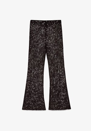 Schwarze Schlaghosen, verziert mit silbernen Pailletten und mit einer strukturierten Oberfläche. Entworfen mit einer hohen Taille und einer weiten Silhouette.