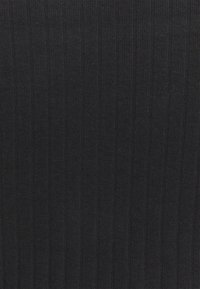 Black ribbed fabric texture with vertical knit pattern, showing fine detail of woven threads and slight variations in shading.
