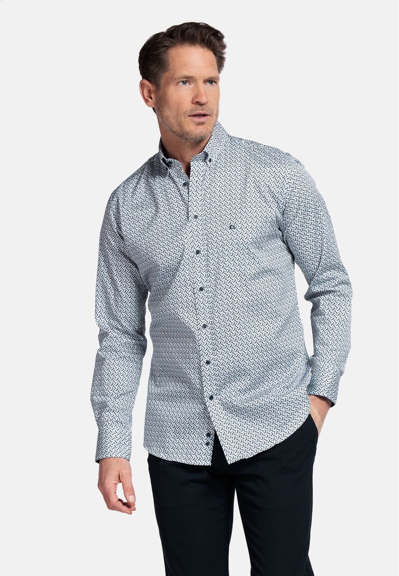 Langarmbutton-up shirt in wit met een marineblauw geometrisch patroon. Katoenen stof, aansluitend design en een puntig kraag.