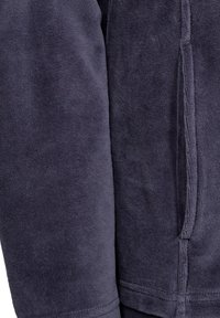 Fleece jacket in dark blue with a soft texture. Features a clean design, long sleeves, and flat seams for a structured look.