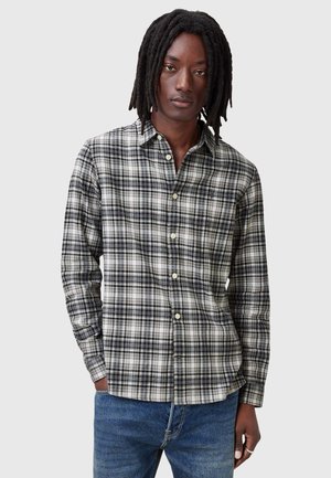 Lange mouw geruite shirt in zwart, grijs en wit met knopen aan de voorkant. Zachte stof met een reguliere pasvorm en een geknoopte kraag.