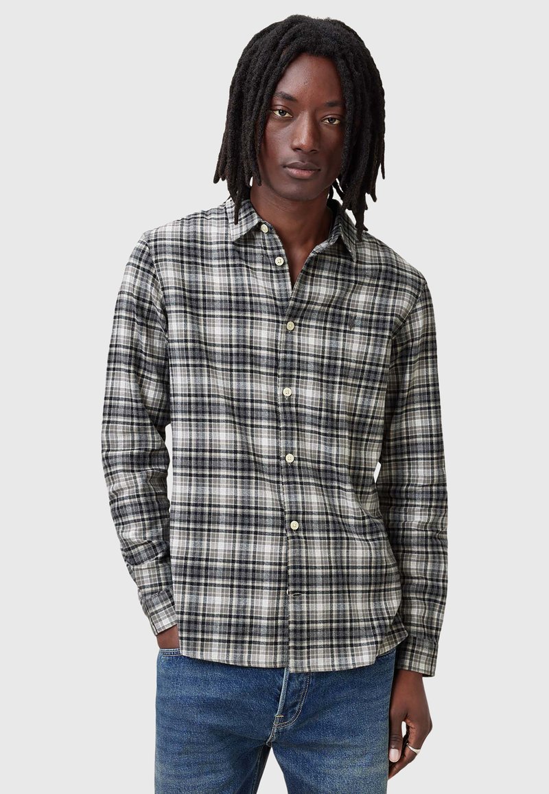 Lange mouw geruite shirt in zwart, grijs en wit met knopen aan de voorkant. Zachte stof met een reguliere pasvorm en een geknoopte kraag.