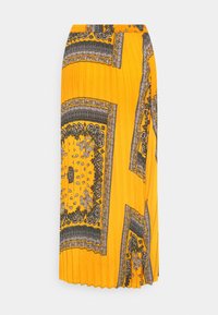 Jupe plissée jaune avec motifs cachemire complexes en noir et blanc et bordures, dotée d'une taille élastique pour le confort.