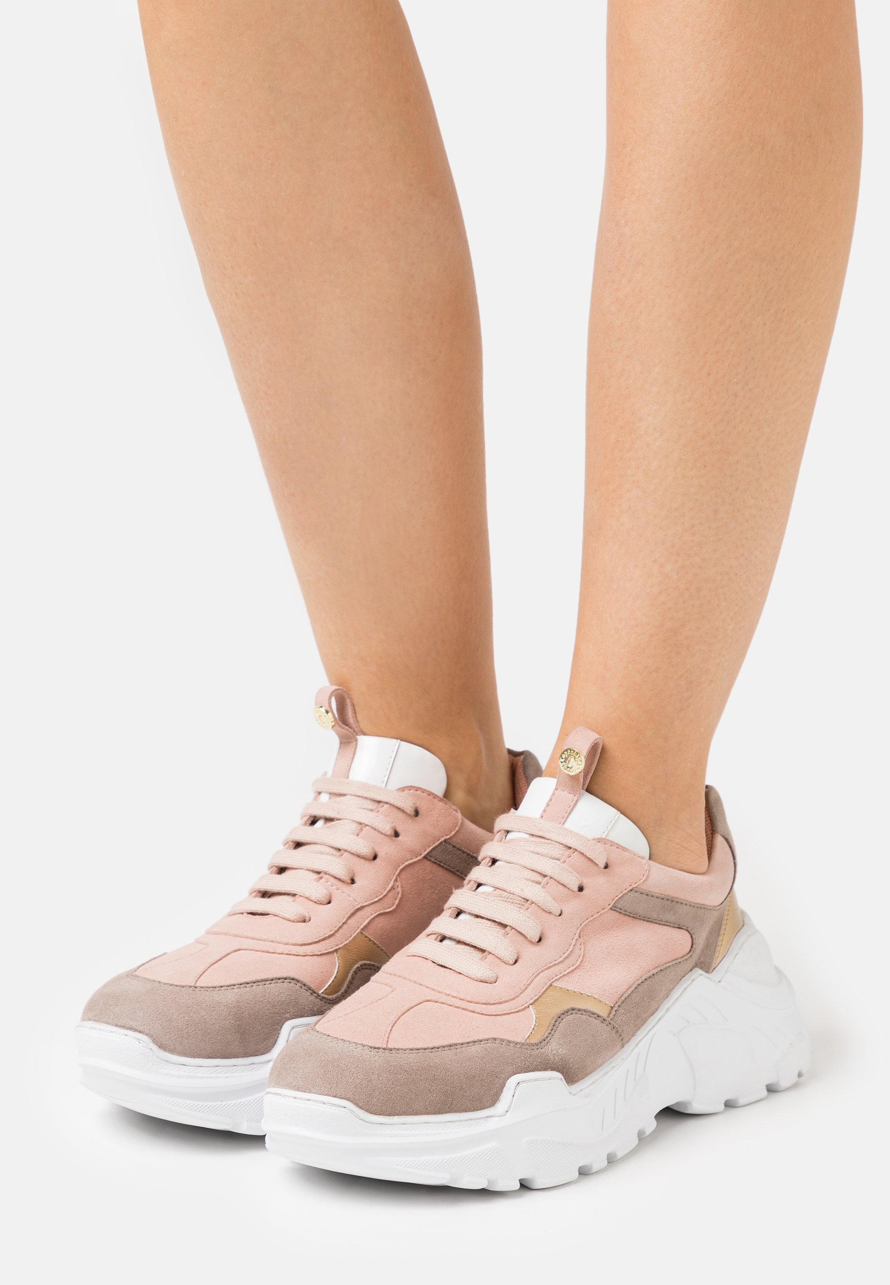 nude coloured trainers