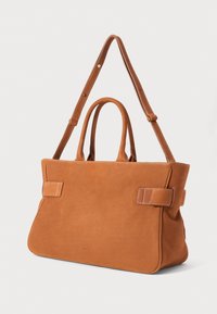 Brown leather tote bag with two top handles and a detachable shoulder strap. Features a smooth texture and visible stitching accents.