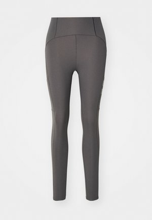 Graue Leggings aus einem glatten, dehnbaren Stoff. Hoch tailliertes Design mit subtilen Nähdetails und enganliegender Silhouette.