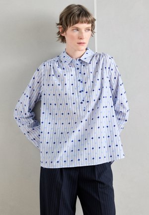 Blue and white striped button-up shirt with polka dots, long sleeves, and a collar. Made of lightweight fabric, slightly loose fit.