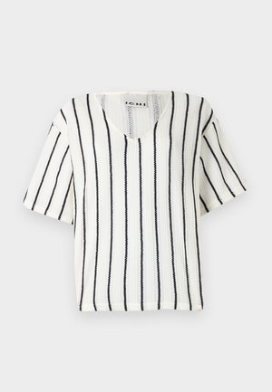 White short-sleeve top with a V-neck, featuring black vertical stripes and a textured knit pattern. Brand label visible inside the collar.