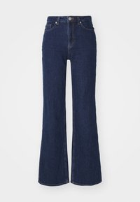 Dark blue denim flared jeans with a high waist, featuring a single button closure and five-pocket design. Smooth texture with subtle stitching details.