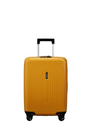 Hard-shell yellow suitcase with a textured linear design, black accents, a telescoping handle, and four wheels for mobility.