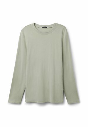 T-shirt à manches longues en coton vert clair, avec un col rond, un ourlet droit et des fentes latérales pour faciliter les mouvements.