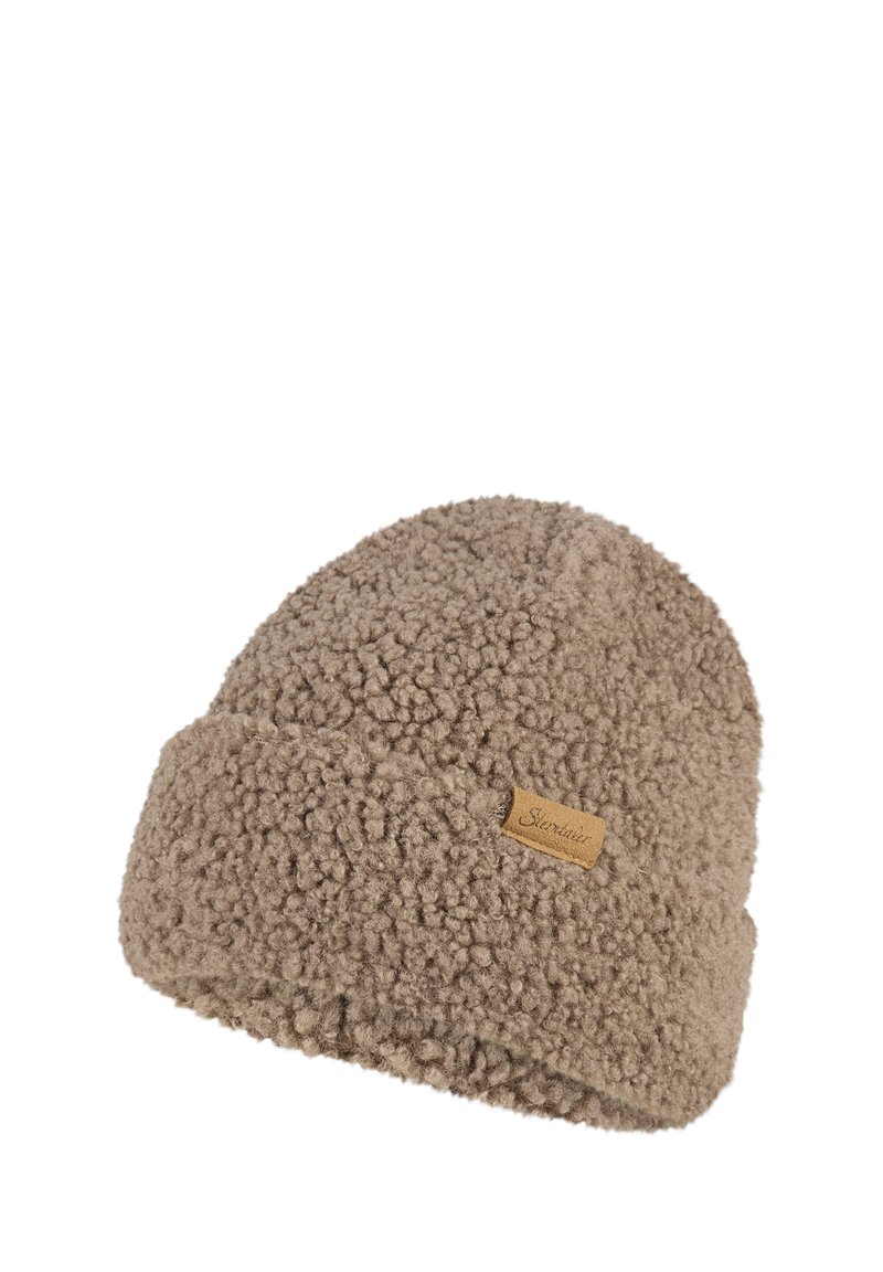 Beige textured fleece beanie with a small stitched fabric label on the folded cuff.