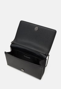 Black synthetic leather bag with a flap top, snap closure, chain strap, and inner pocket featuring the brand name "LOVE MOSCHINO."