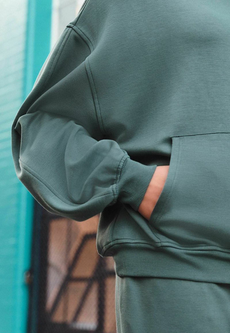New Balance Haut à Capuche Homme Bleu