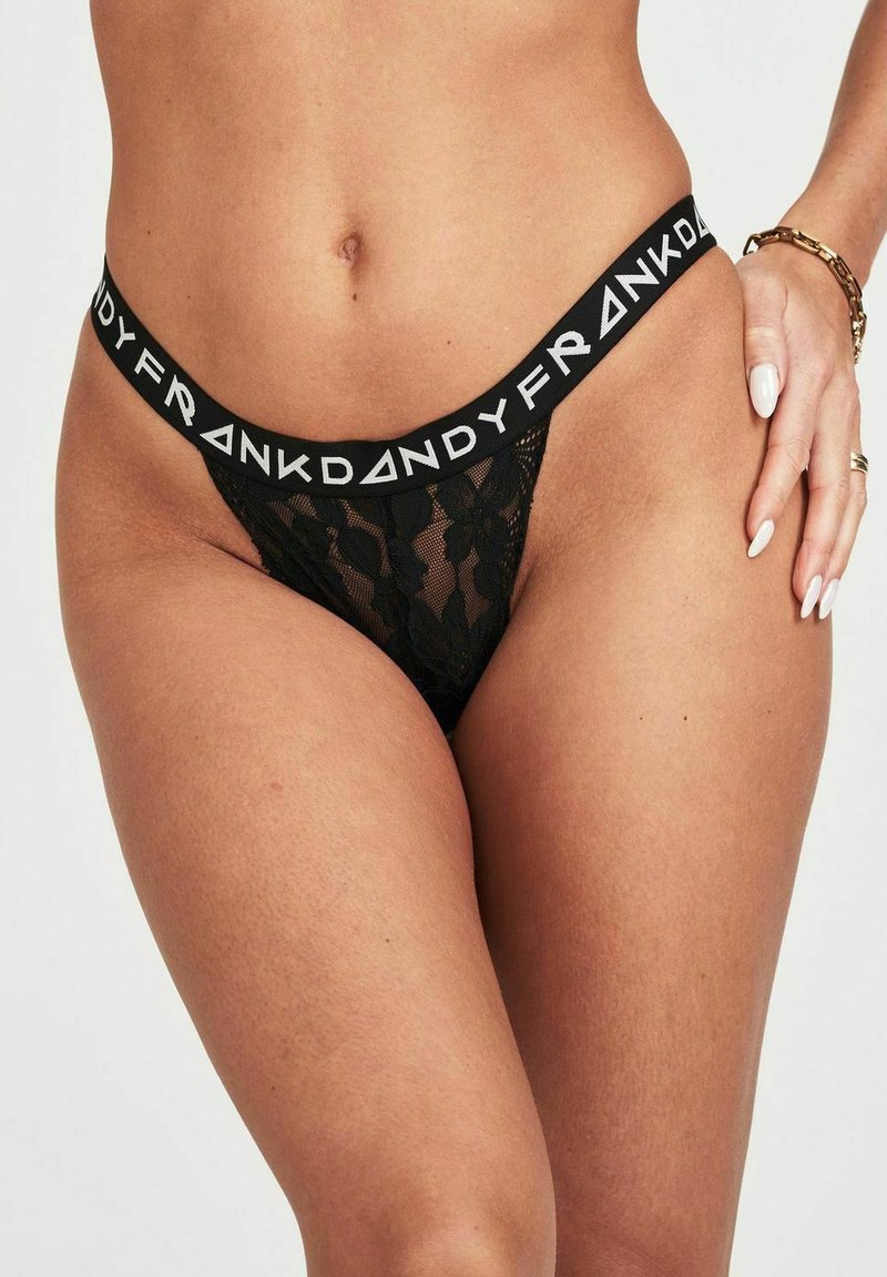 Czarny koronkowy thong w kwiatowy wzór, z szerokim elastycznym paskiem w talii z białym napisem "FRANK DANDY".