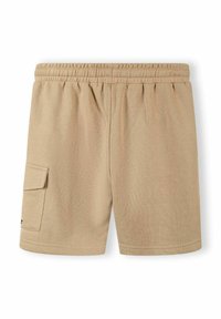 Beige pamut rövidnadrág elasztikus derékkal, oldalzsebekkel és egy cargo zsebbel a bal lábon. Simább textúra, laza dizájn.
