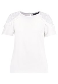Blouse blanche à manches courtes avec des accents en dentelle sur les épaules, des bords froncés et une fermeture en forme de clé au dos. Texture lisse et design ajusté.