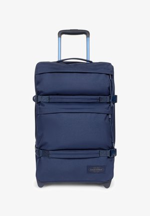 Navy blue soft-sided wheeled suitcase with telescoping handle, two compression straps, zippered compartments, and Eastpak logo on front bottom corner.