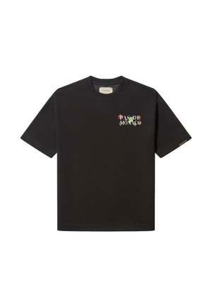 Schwarzes Baumwoll-T-Shirt mit kurzen Ärmeln, geripptem Rundhalsausschnitt und besticktem "PAS DE MONACO" in bunten Blumenbuchstaben auf der Brust.