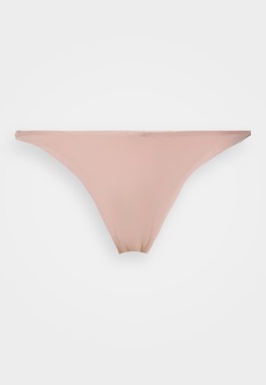 Pink thong underwear made from smooth, elastic fabric. Moderate coverage with a seamless design and thin waistband. No visible embellishments.