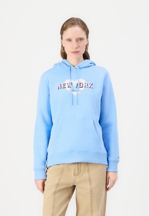 Light blue hooded sweatshirt with a front pocket, featuring a print that reads "NEW YORK" in bold pink and black letters. Soft fabric.