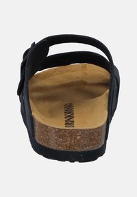Black open-toe sandal with double straps and buckle, cork footbed, and contoured tan suede insole shown from the rear.