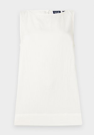 White sleeveless crew neck top with a small GAP label visible at the back neckline, laid flat on a light background.
