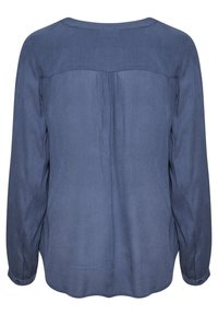 Dunkelbluse mit langen Ärmeln aus leichtem Stoff. Verfügt über einen runden Halsausschnitt, eine Rückfalte und geknöpfte Manschetten.